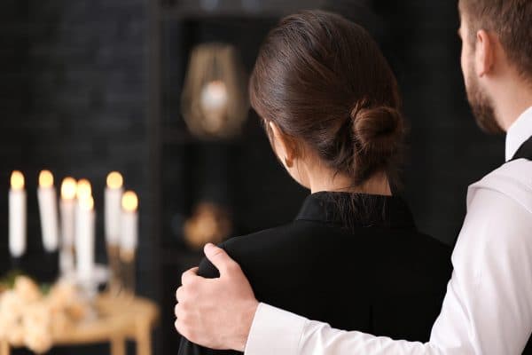 Couple at a funeral visitation